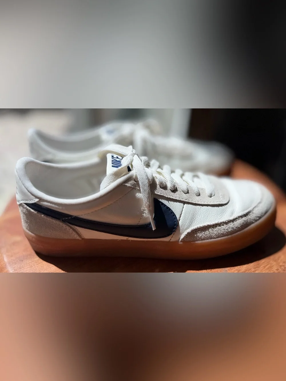 Nike Killshot 2 sneakers featuring a distinct gum rubber sole and navy swoosh 9